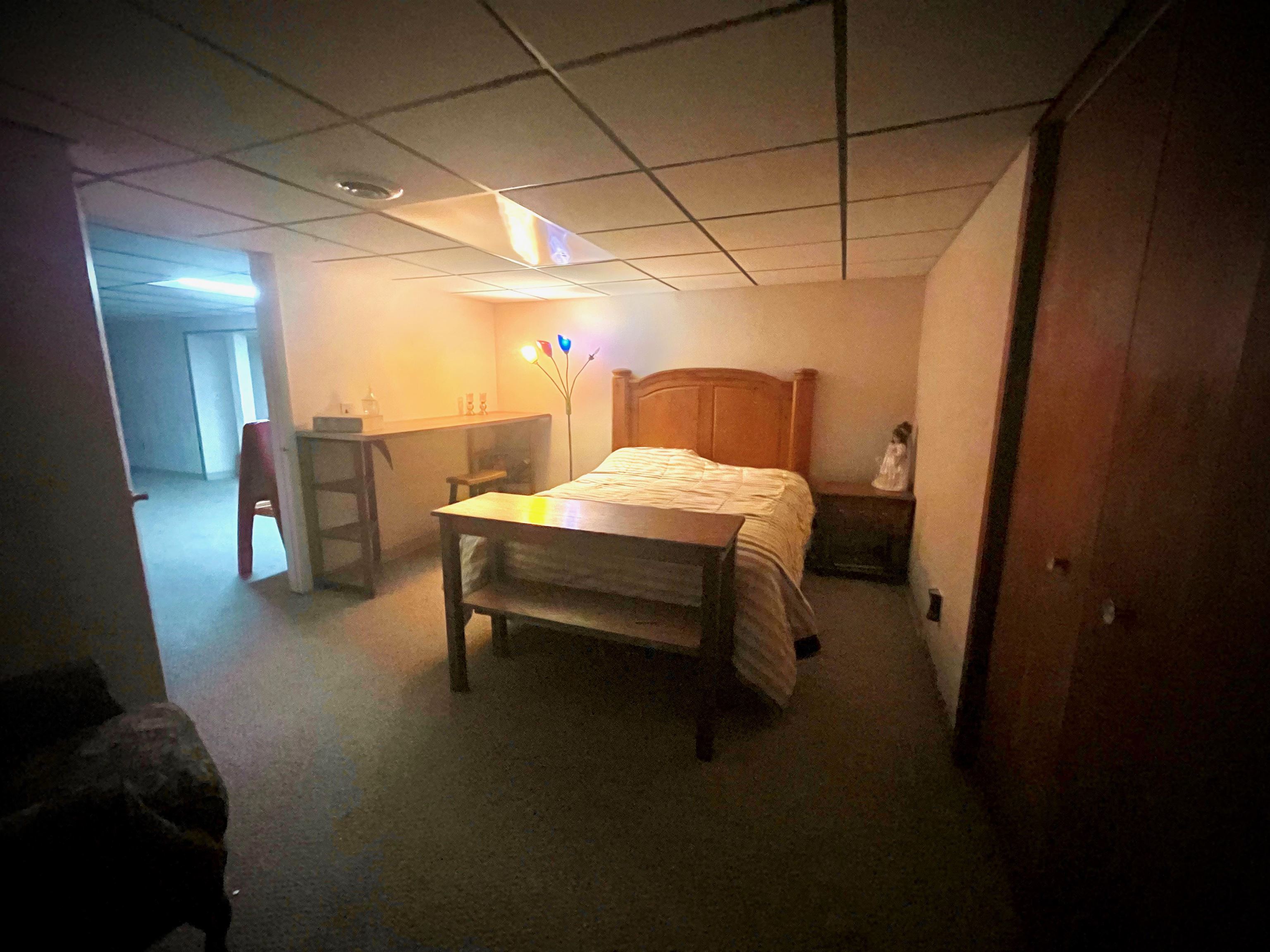 7356 Kishwaukee Road Rockford, IL 61109 - Photo 45 of 71 a bedroom with a bed and a table in it