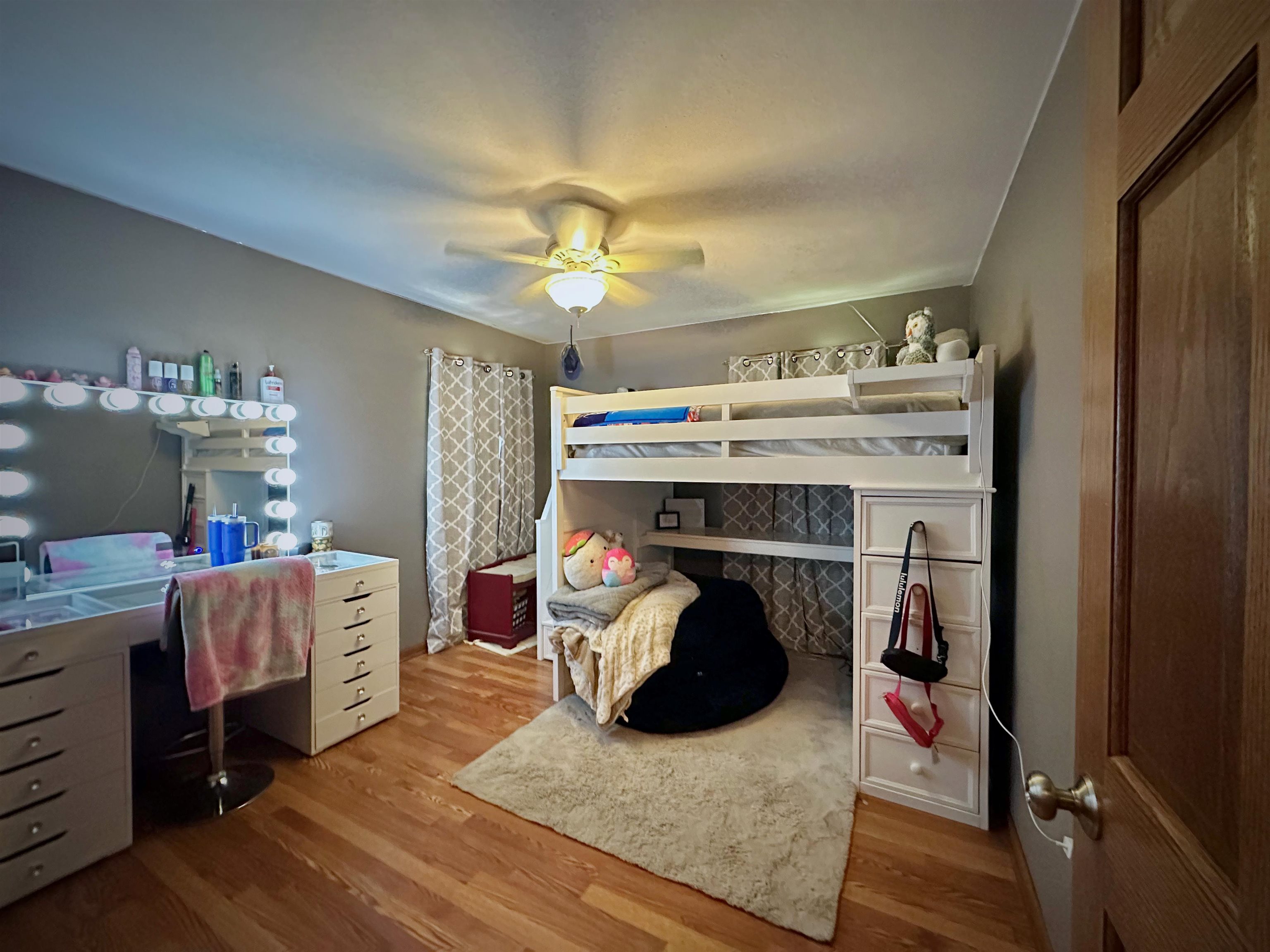 7356 Kishwaukee Road Rockford, IL 61109 - Photo 49 of 71 a bed room with a bed and a chandelier