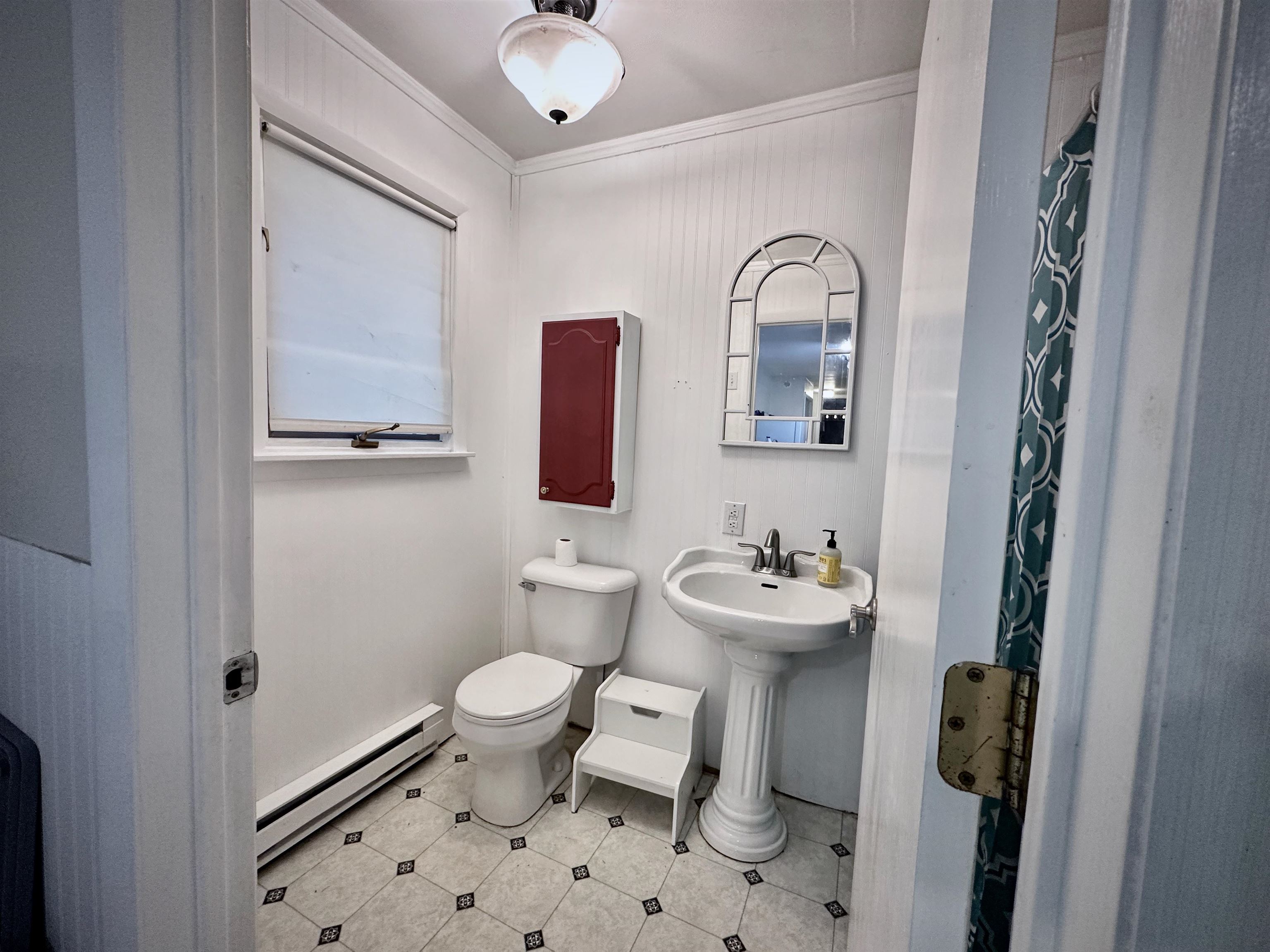 7356 Kishwaukee Road Rockford, IL 61109 - Photo 57 of 71 a bathroom with a sink mirror and toilet