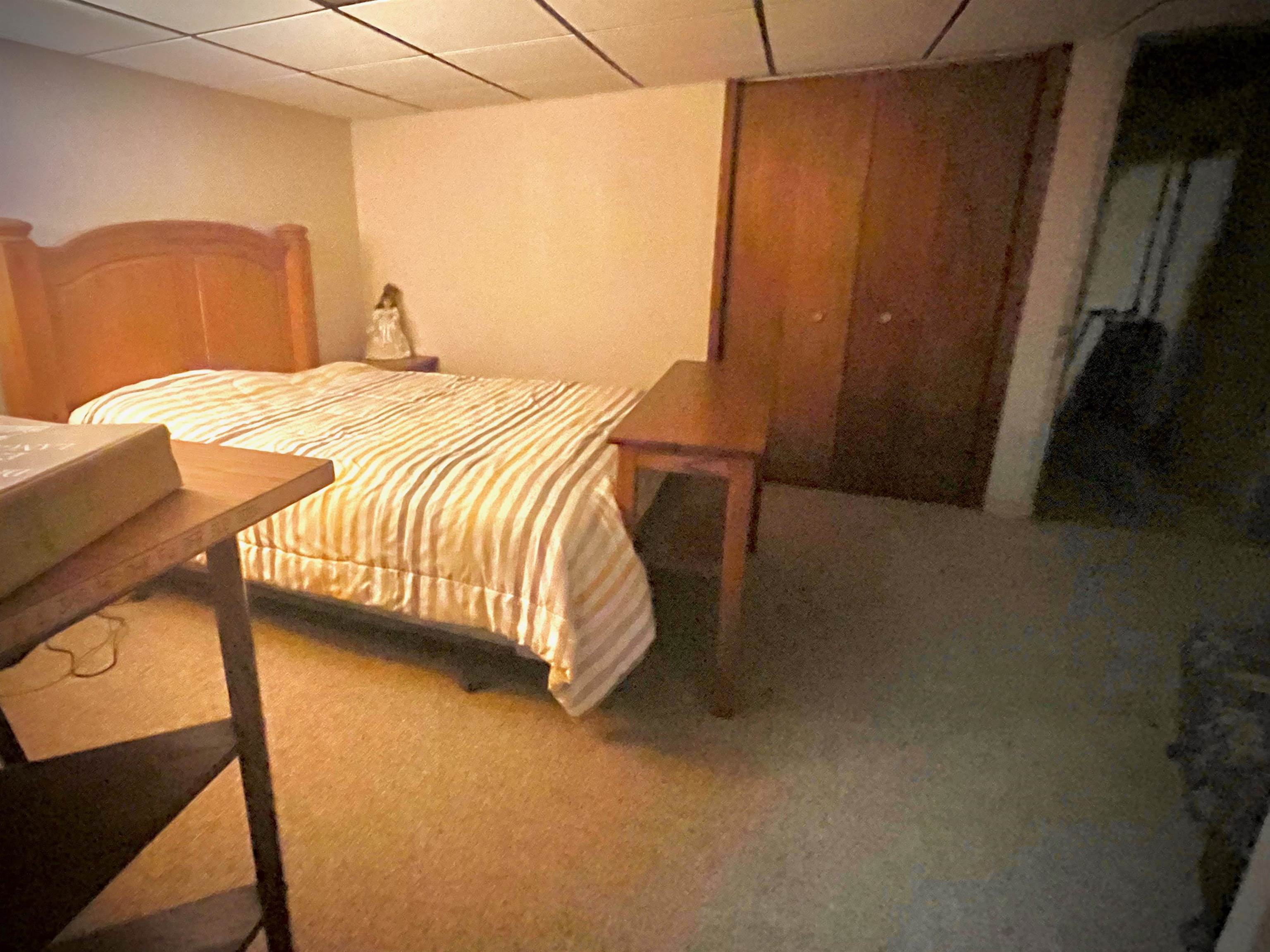 7356 Kishwaukee Road Rockford, IL 61109 - Photo 64 of 71 a bedroom with a bed and wooden floor