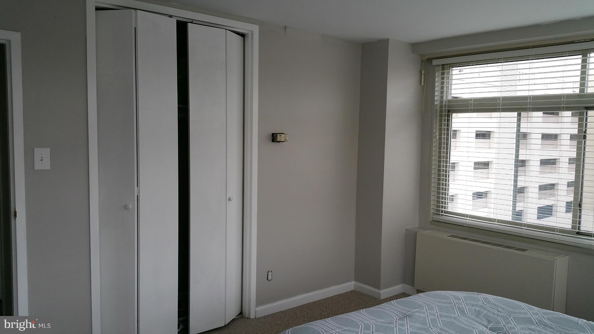 2401 H Street Northwest, Unit 904 Washington, DC 20037 - Photo 12 of 25 a view of bedroom and window