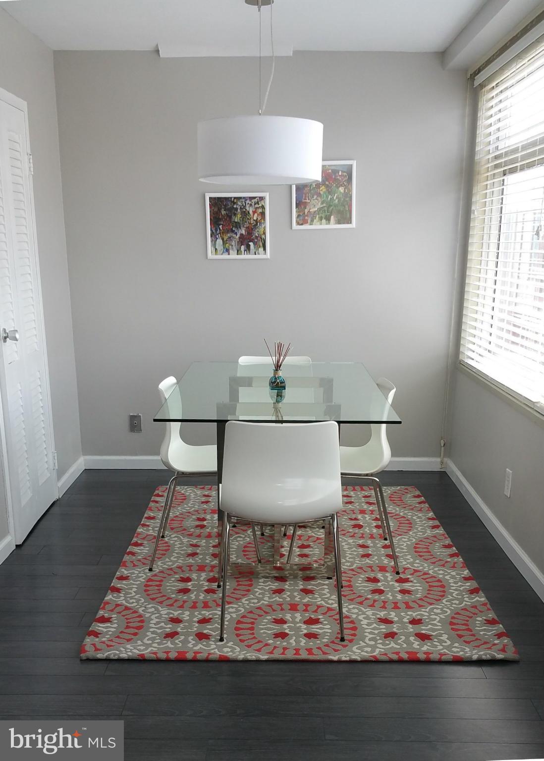 2401 H Street Northwest, Unit 904 Washington, DC 20037 - Photo 5 of 25 a living room with furniture and a rug