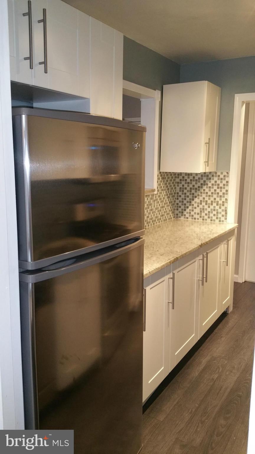 2401 H Street Northwest, Unit 904 Washington, DC 20037 - Photo 9 of 25 a close view of stove and microwave
