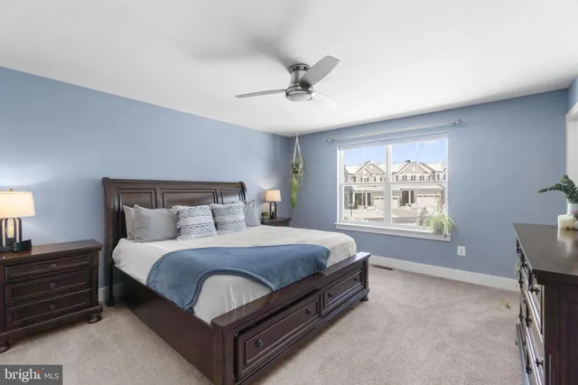 a bed room with a bed and a window