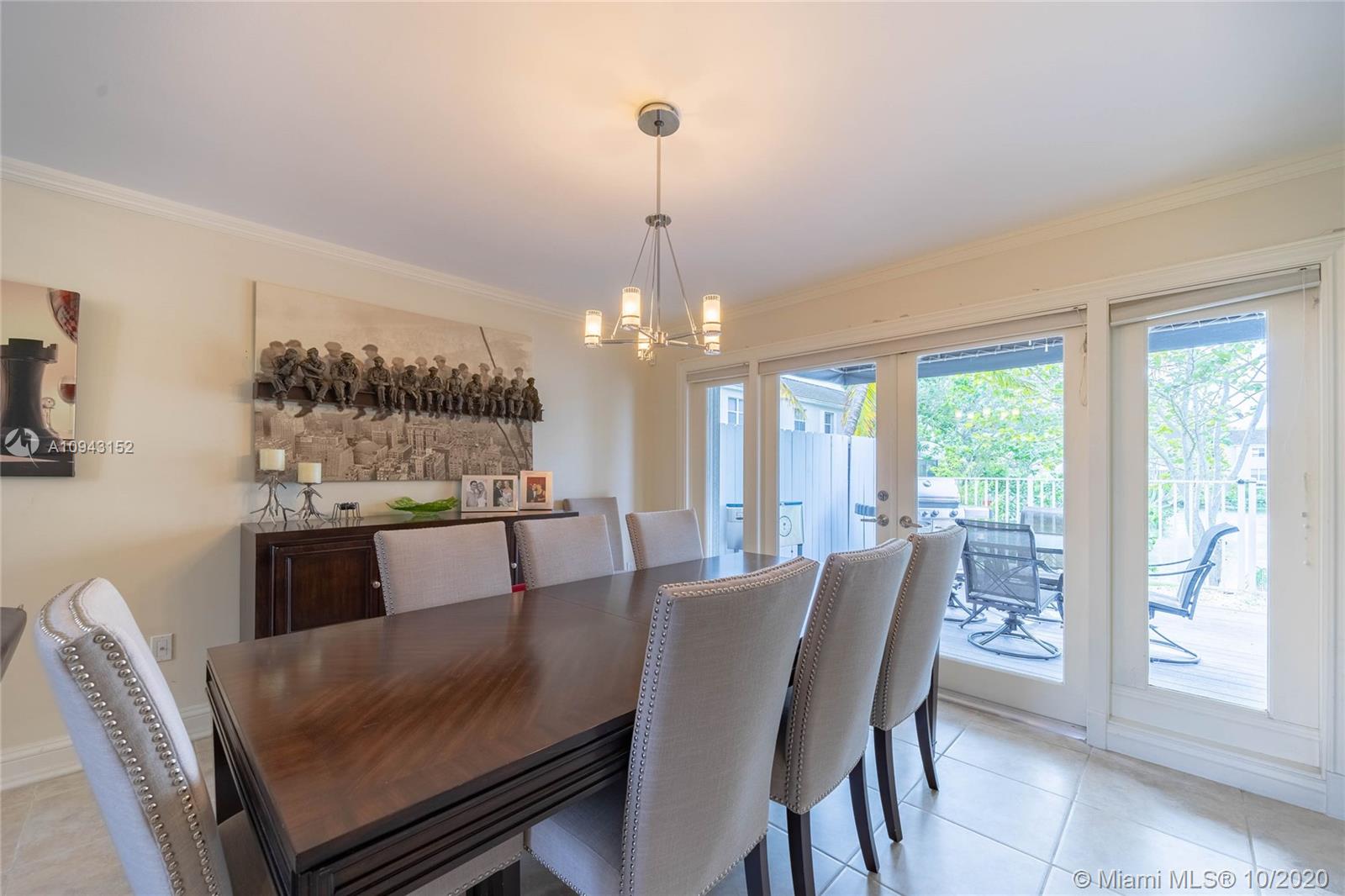 5580 Southwest 70th Place South Miami, FL 33155 - Photo 6 of 13 a view of a dining room with furniture window and outside view