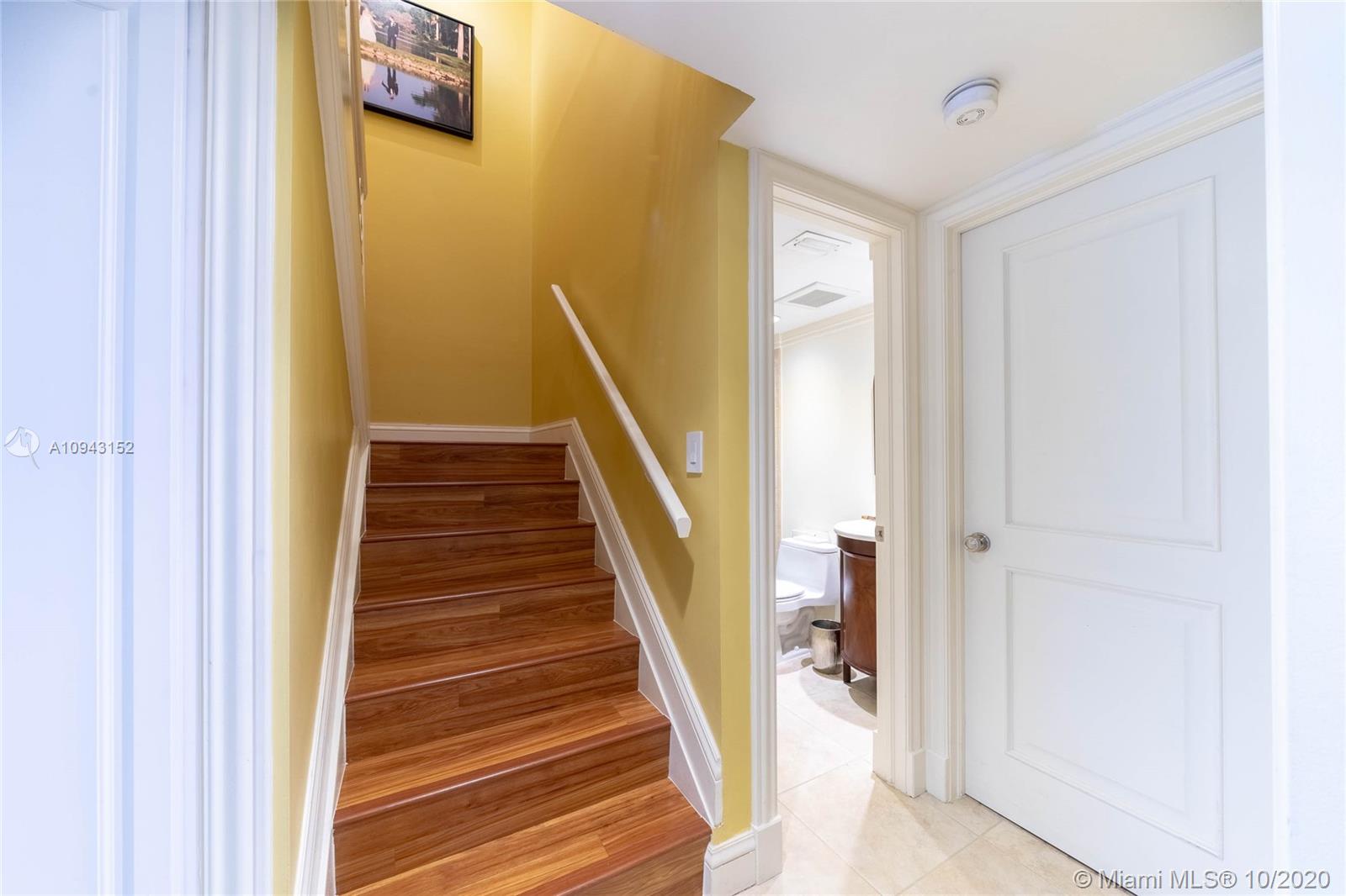 5580 Southwest 70th Place South Miami, FL 33155 - Photo 7 of 13 a view of a hallway with wooden floor and entryway