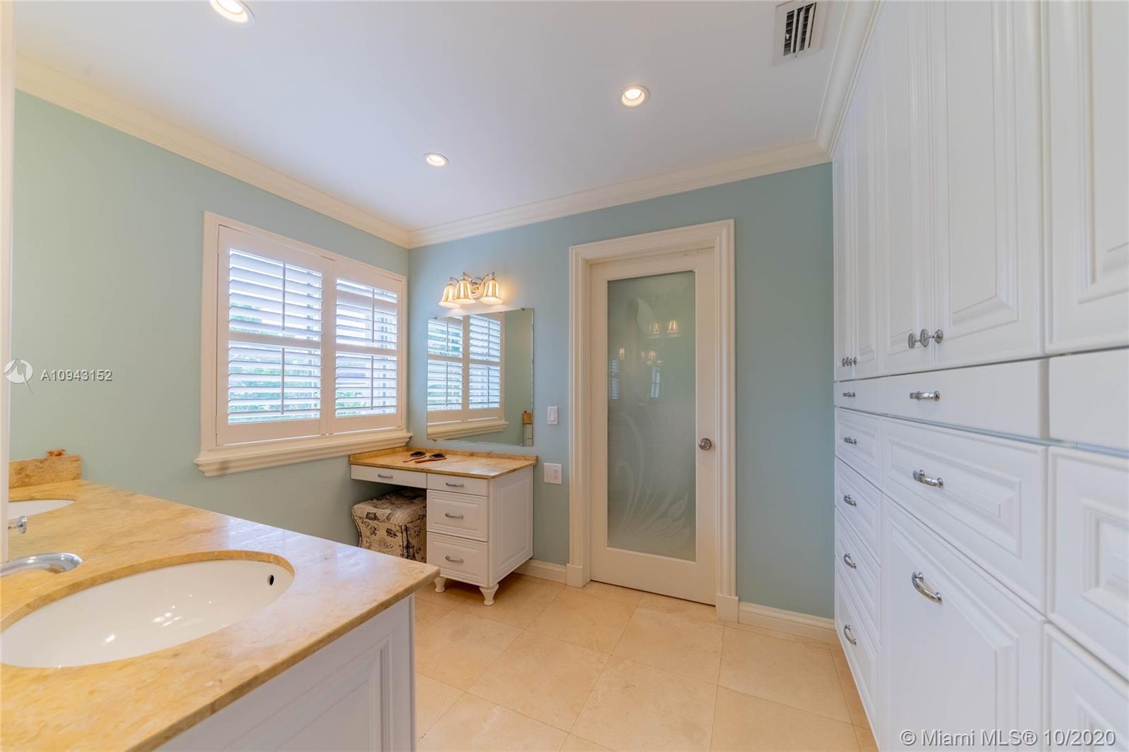 5580 Southwest 70th Place South Miami, FL 33155 - Photo 9 of 13 a spacious bathroom with a sink a tub and a window