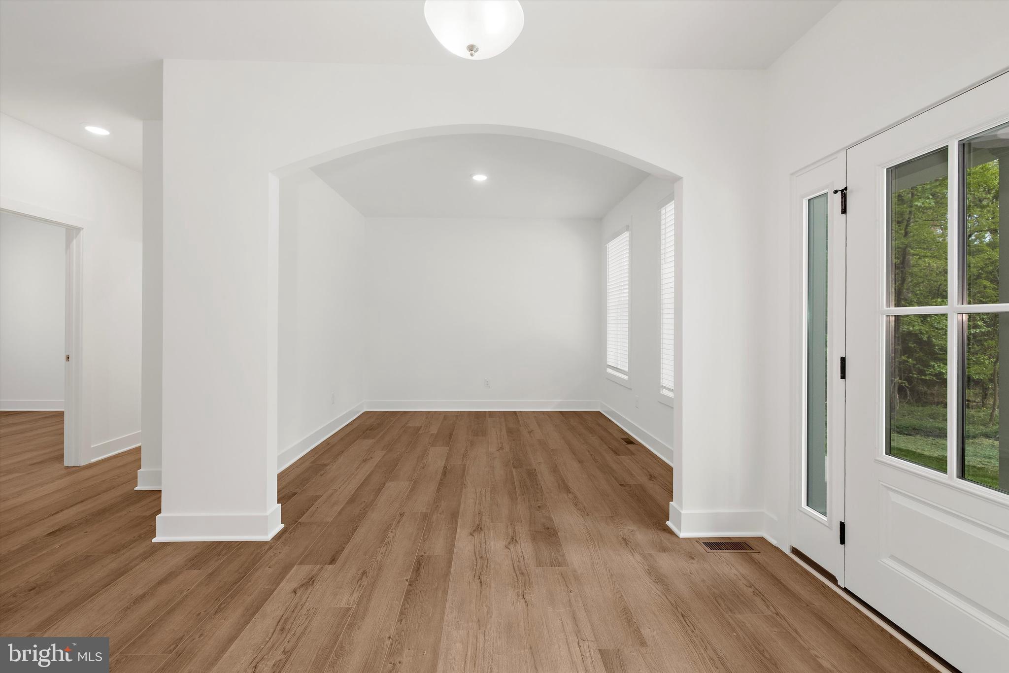 1807 Mountain Bay Road Pasadena, MD 21122 - Photo 15 of 75 wooden floor in an empty room with a window