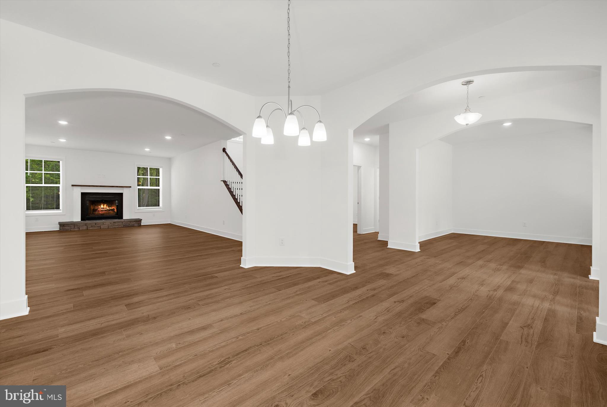 1807 Mountain Bay Road Pasadena, MD 21122 - Photo 17 of 75 a view of a livingroom with wooden floor and a kitchen space