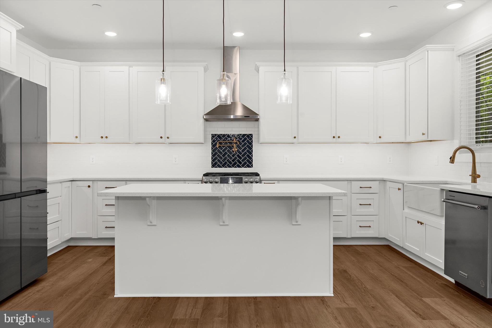 1807 Mountain Bay Road Pasadena, MD 21122 - Photo 21 of 75 a kitchen with stainless steel appliances granite countertop a sink a stove and a refrigerator