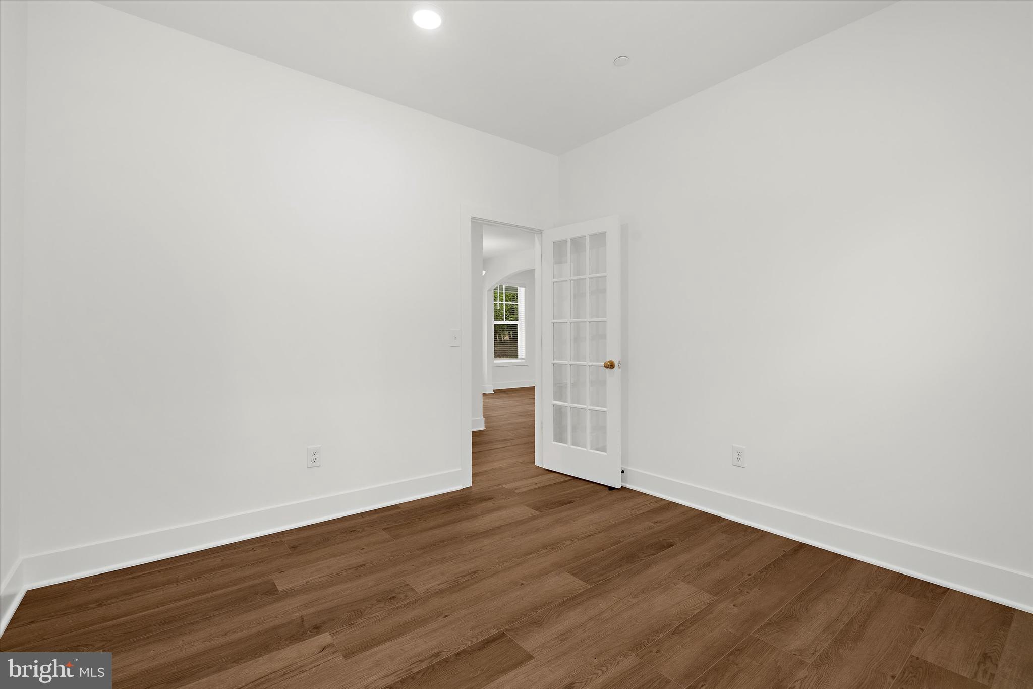 1807 Mountain Bay Road Pasadena, MD 21122 - Photo 28 of 75 a view of an empty room with wooden floor