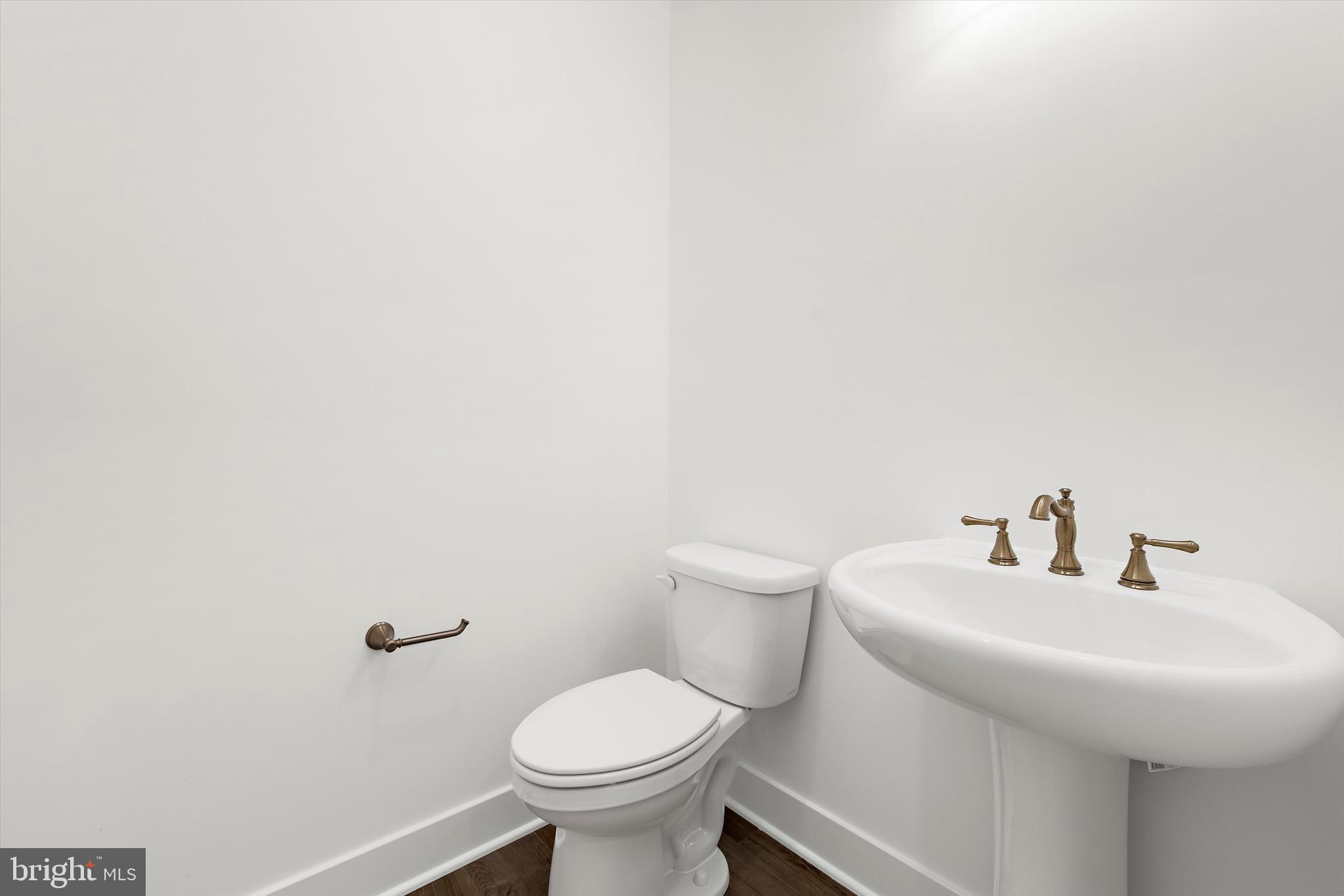 1807 Mountain Bay Road Pasadena, MD 21122 - Photo 29 of 75 a bathroom with a sink and a toilet