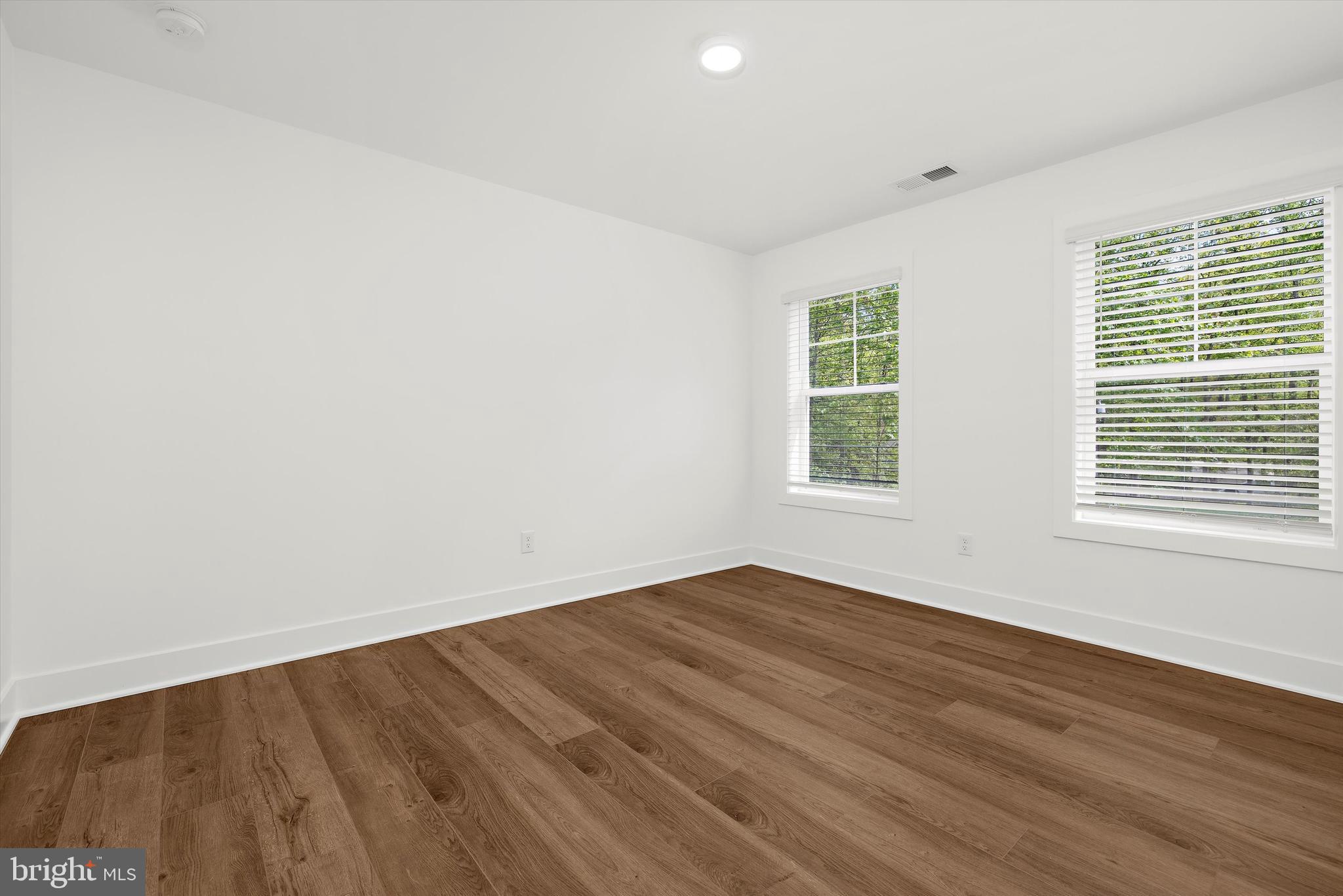 1807 Mountain Bay Road Pasadena, MD 21122 - Photo 37 of 75 wooden floor in an empty room with a window