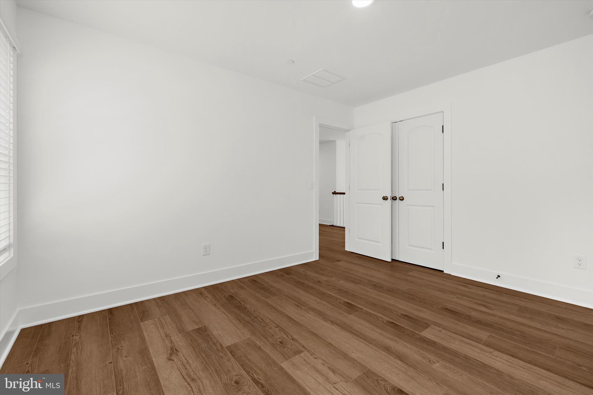 1807 Mountain Bay Road Pasadena, MD 21122 - Photo 38 of 75 a view of an empty room with wooden floor