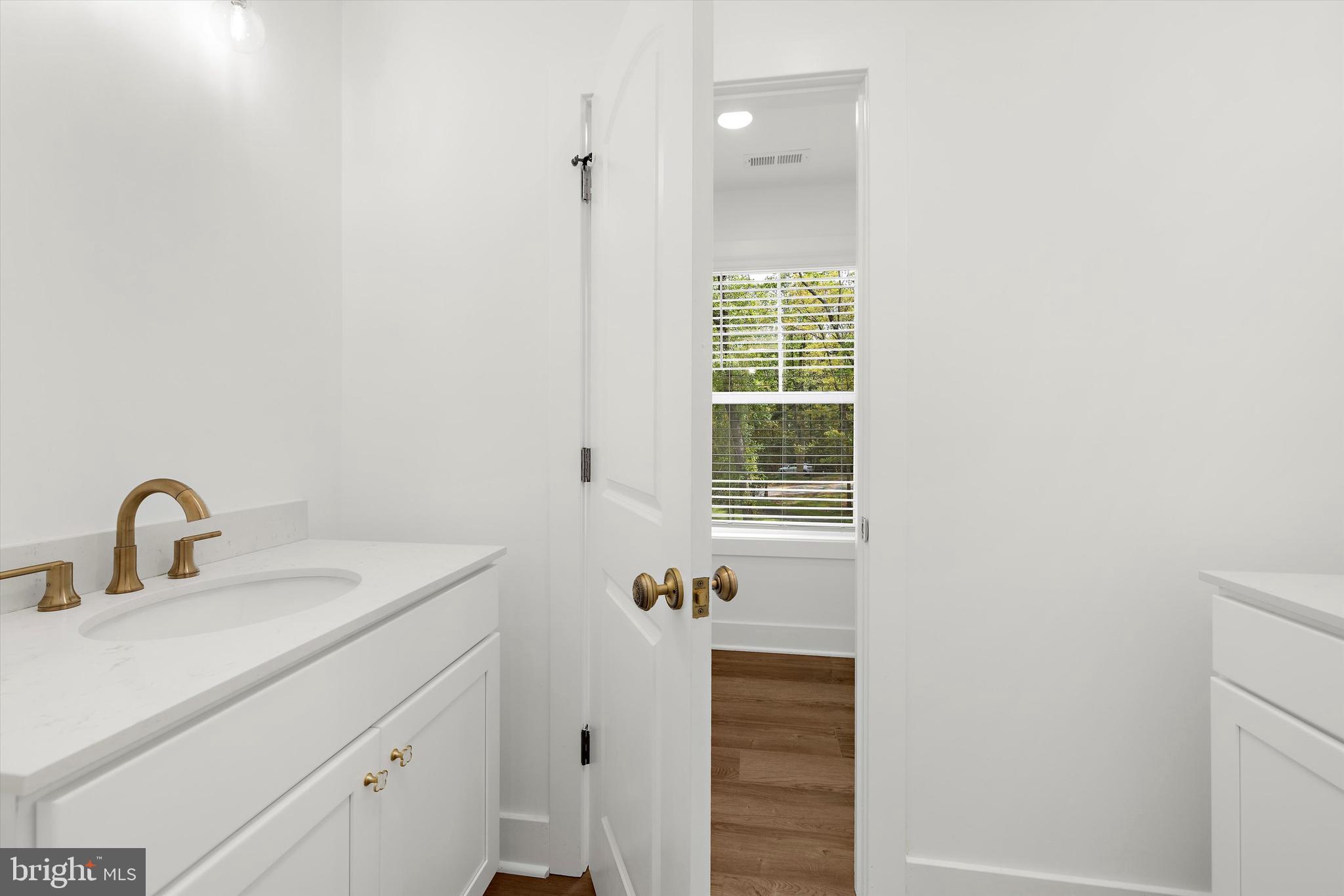 1807 Mountain Bay Road Pasadena, MD 21122 - Photo 39 of 75 a bathroom with a sink and a mirror