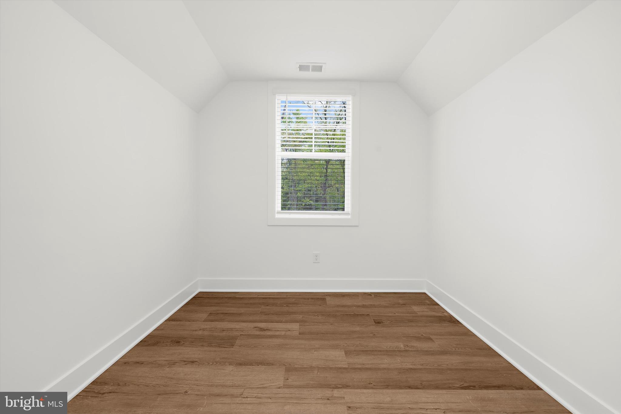 1807 Mountain Bay Road Pasadena, MD 21122 - Photo 49 of 75 a view of a room with wooden floor and windows