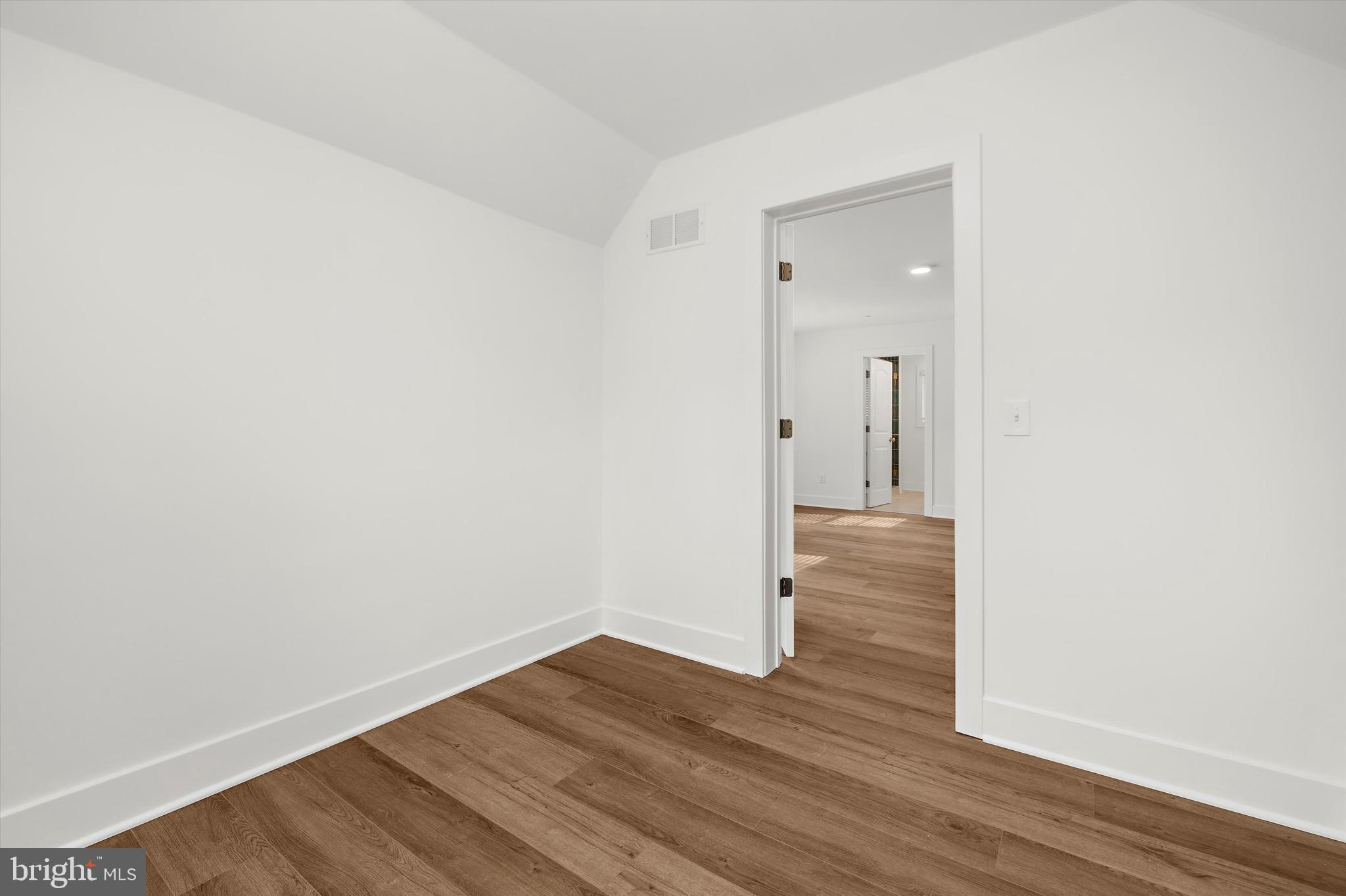 1807 Mountain Bay Road Pasadena, MD 21122 - Photo 50 of 75 a view of an empty room with wooden floor