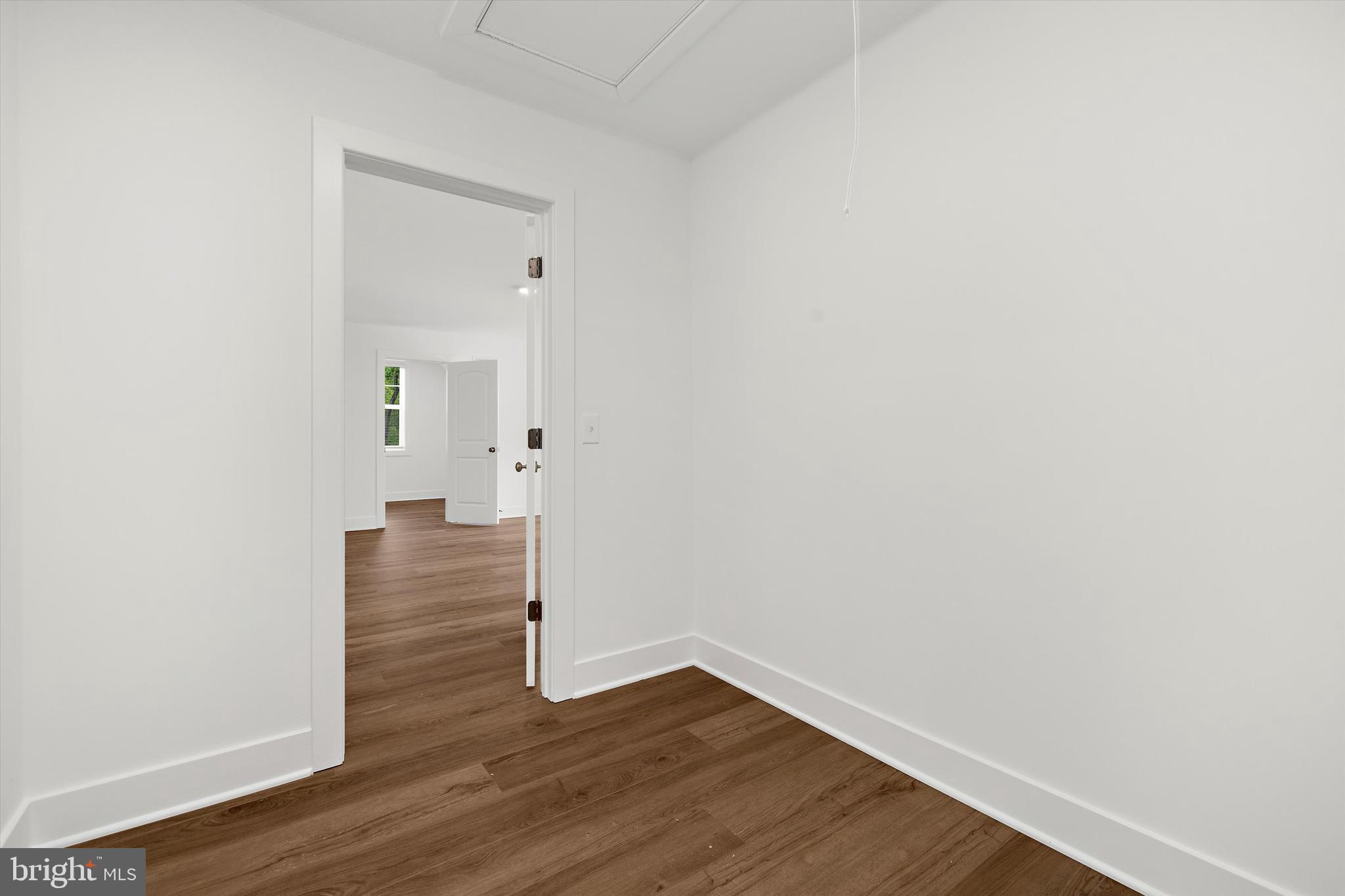 1807 Mountain Bay Road Pasadena, MD 21122 - Photo 52 of 75 a view of an empty room with wooden floor