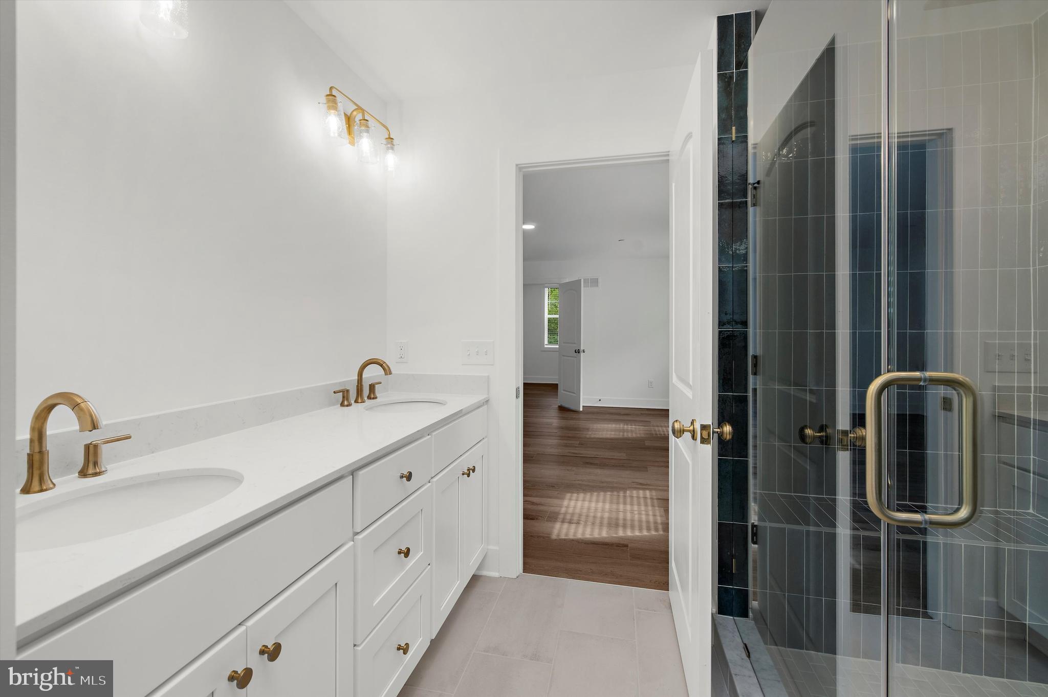 1807 Mountain Bay Road Pasadena, MD 21122 - Photo 54 of 75 a bathroom with a toilet sink a mirror and shower