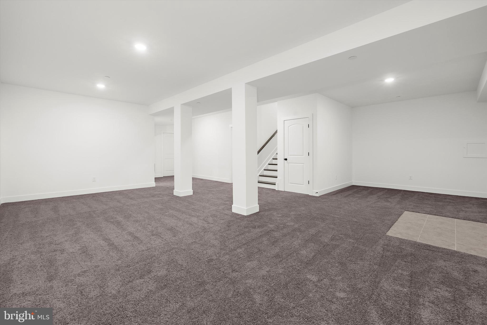 1807 Mountain Bay Road Pasadena, MD 21122 - Photo 56 of 75 an empty room with staircase and white walls