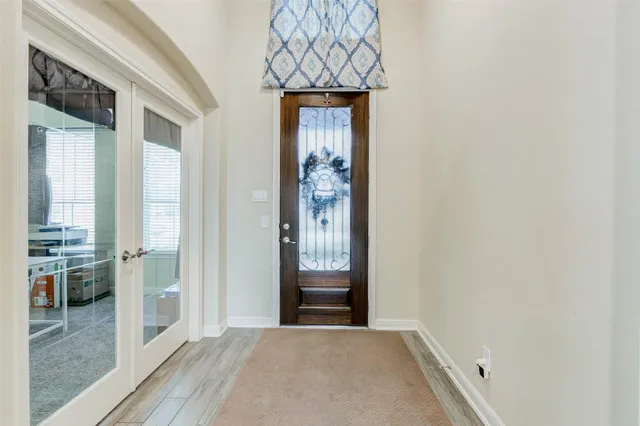 a view of a hallway view with wooden floor and staircase