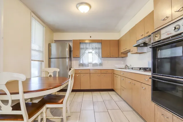 a kitchen with a sink appliances and cabinets