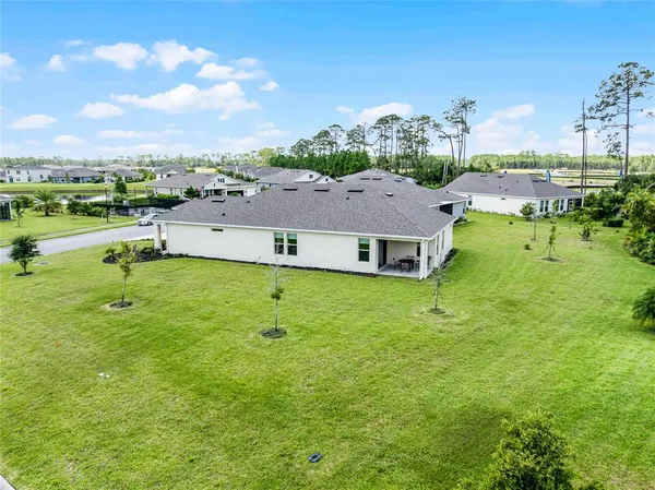 a view of a house with a big yard