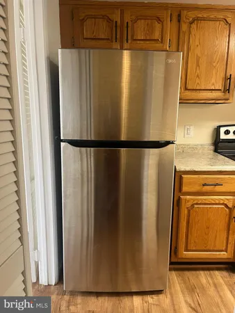a view of a refrigerator in kitchen