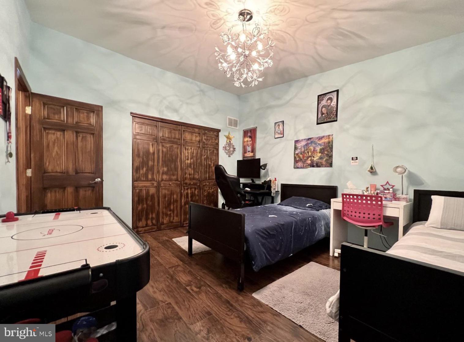 52 Sandpiper Drive Voorhees, NJ 08043 - Photo 11 of 26 a bedroom with a bed and wooden floor