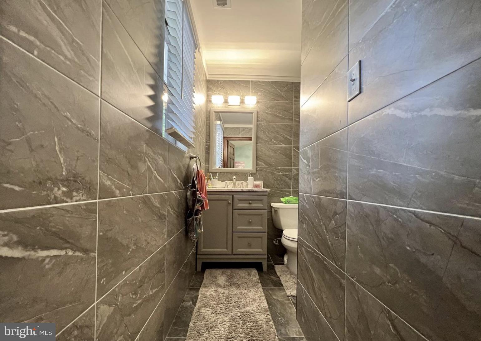 52 Sandpiper Drive Voorhees, NJ 08043 - Photo 12 of 26 a bathroom with a sink and a toilet