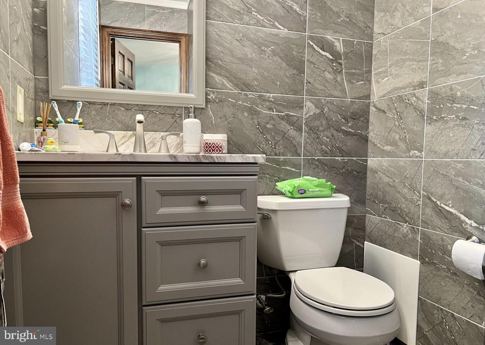 52 Sandpiper Drive Voorhees, NJ 08043 - Photo 13 of 26 a bathroom with a granite countertop toilet sink and mirror