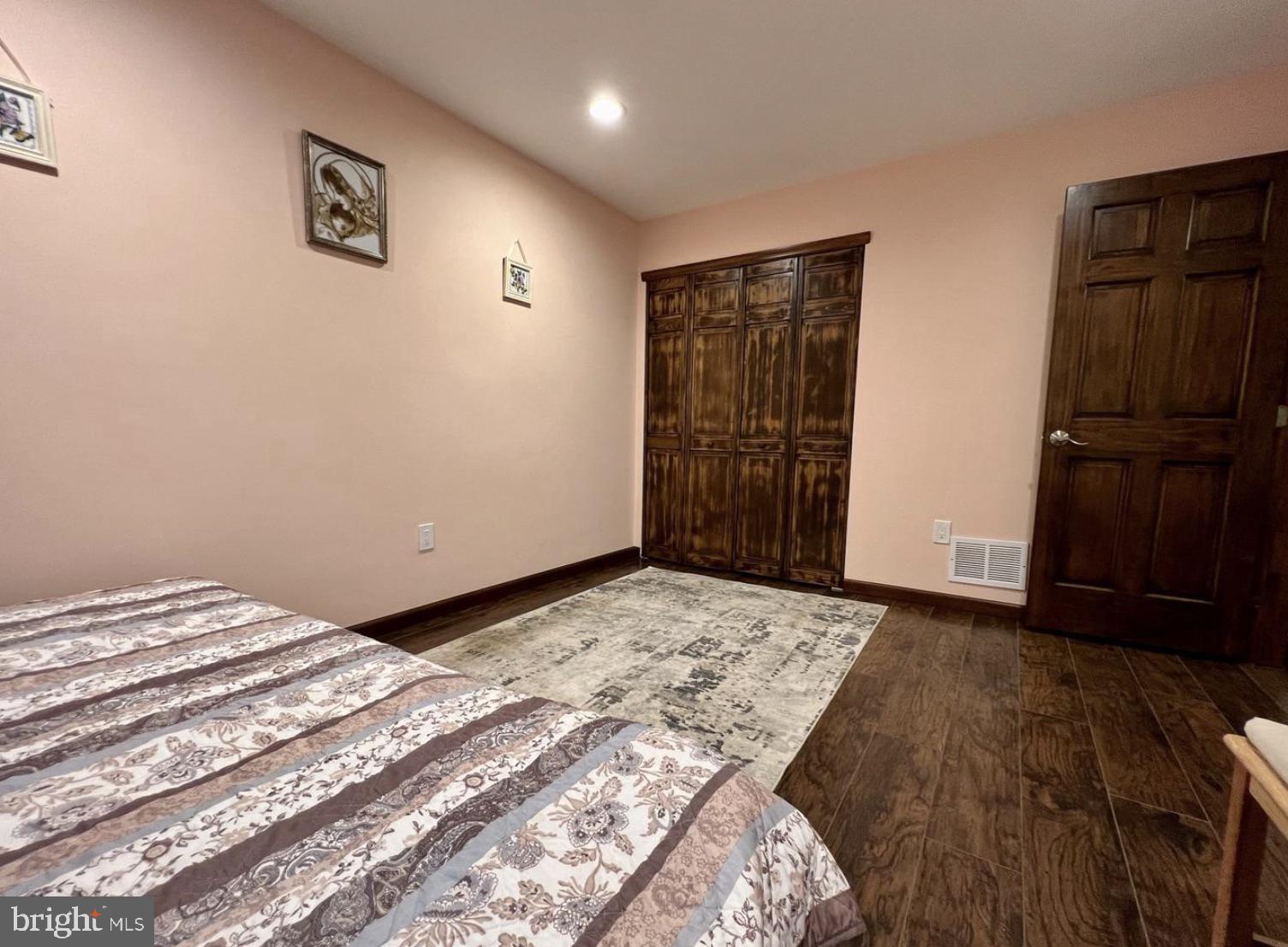 52 Sandpiper Drive Voorhees, NJ 08043 - Photo 15 of 26 a bedroom with a bed and wooden floor