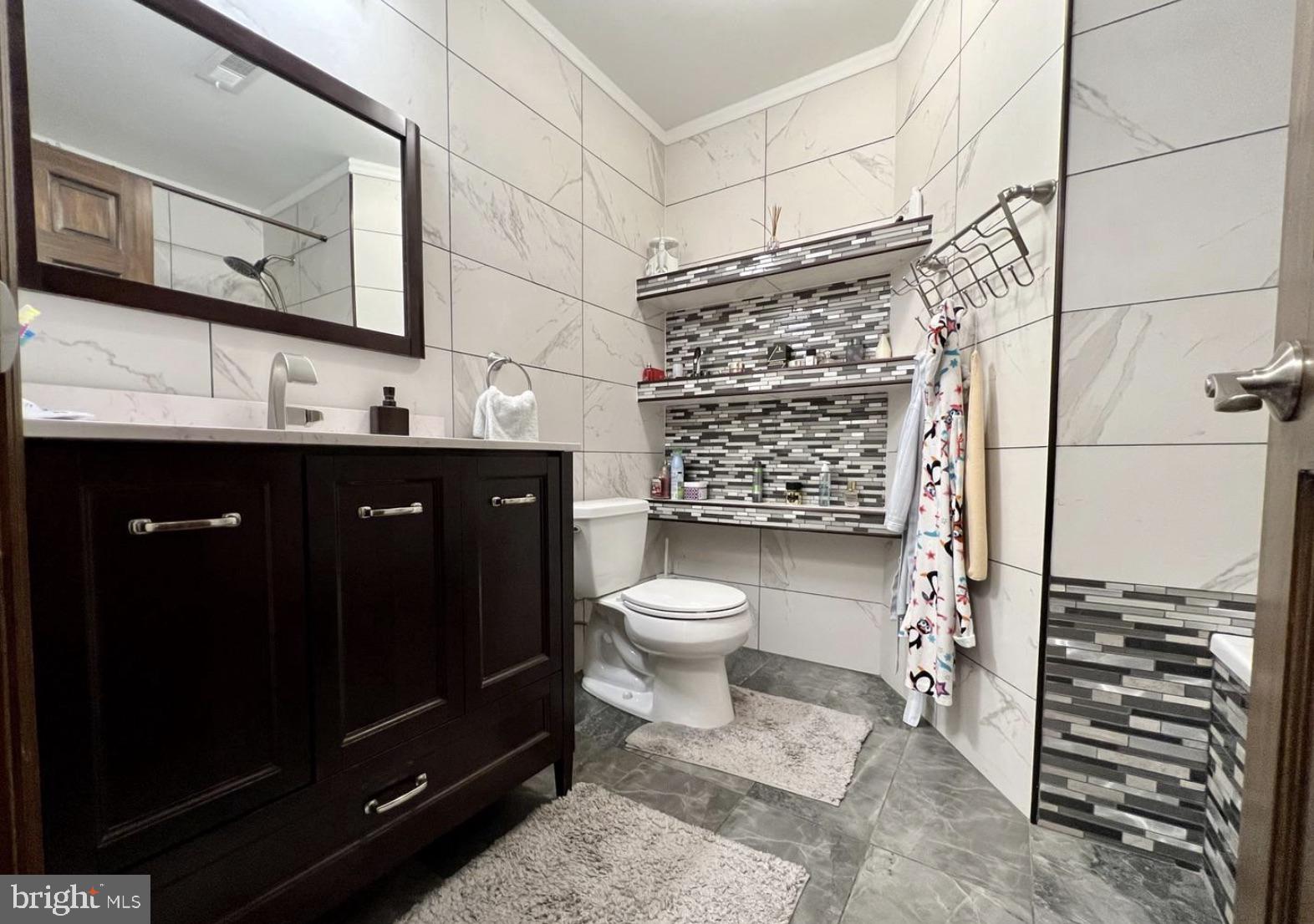 52 Sandpiper Drive Voorhees, NJ 08043 - Photo 16 of 26 a bathroom with a sink a toilet and shower