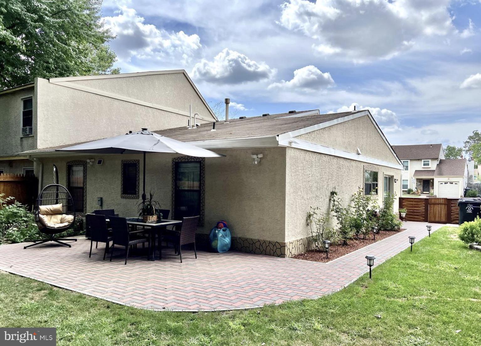 52 Sandpiper Drive Voorhees, NJ 08043 - Photo 24 of 26 a view of a house with sitting area and garden