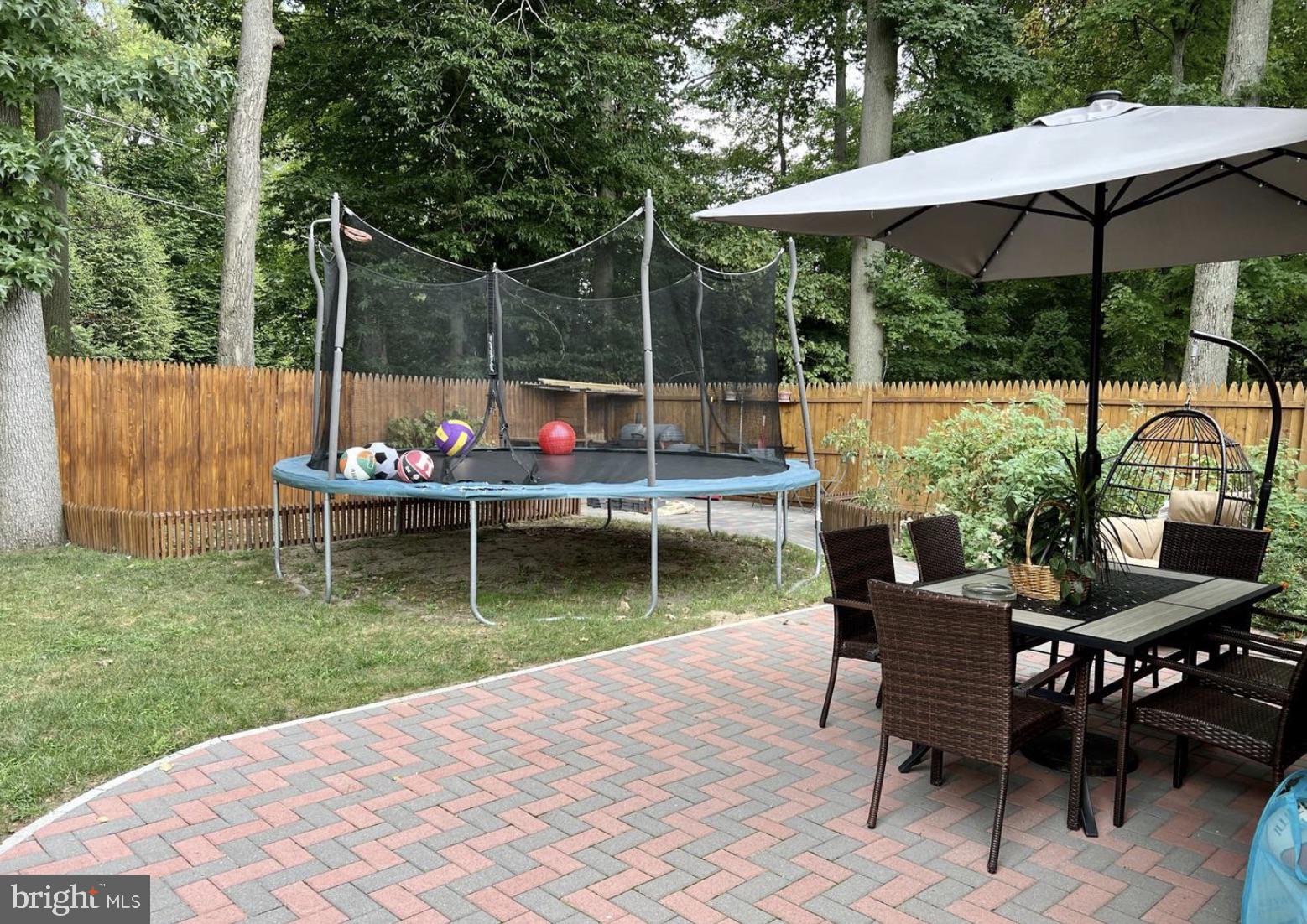 52 Sandpiper Drive Voorhees, NJ 08043 - Photo 25 of 26 a view of a chair and table in the garden