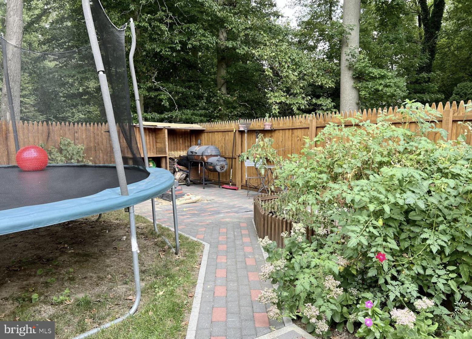 52 Sandpiper Drive Voorhees, NJ 08043 - Photo 26 of 26 a view of a chair and table in the garden