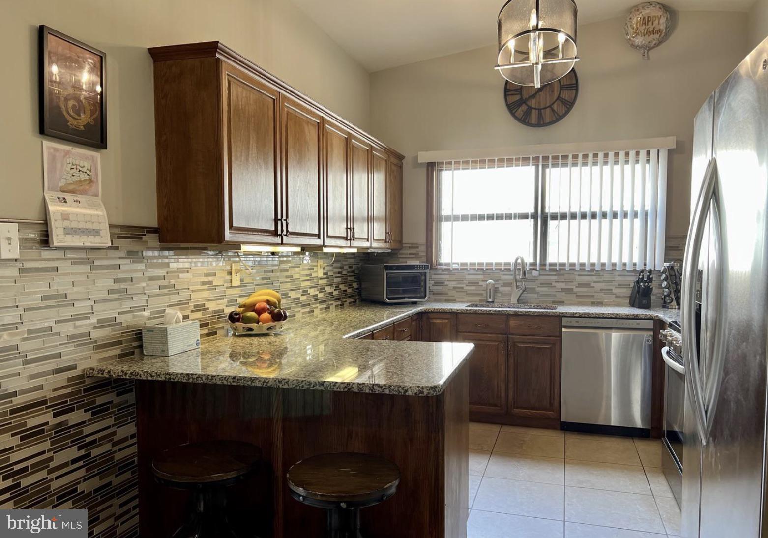 52 Sandpiper Drive Voorhees, NJ 08043 - Photo 7 of 26 a kitchen with a sink cabinets and window