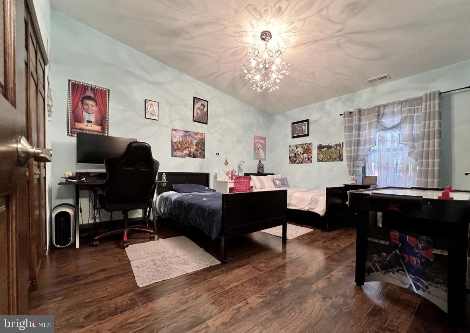 52 Sandpiper Drive Voorhees, NJ 08043 - Photo 10 of 26 a living room with furniture or chandelier and a wooden floor