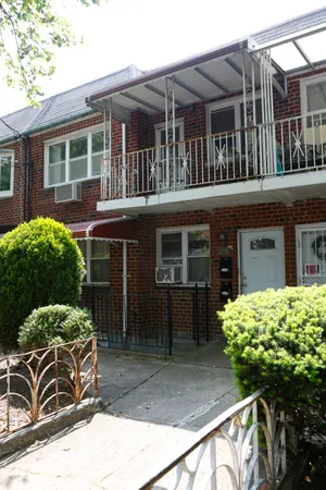 a front view of a house with balcony