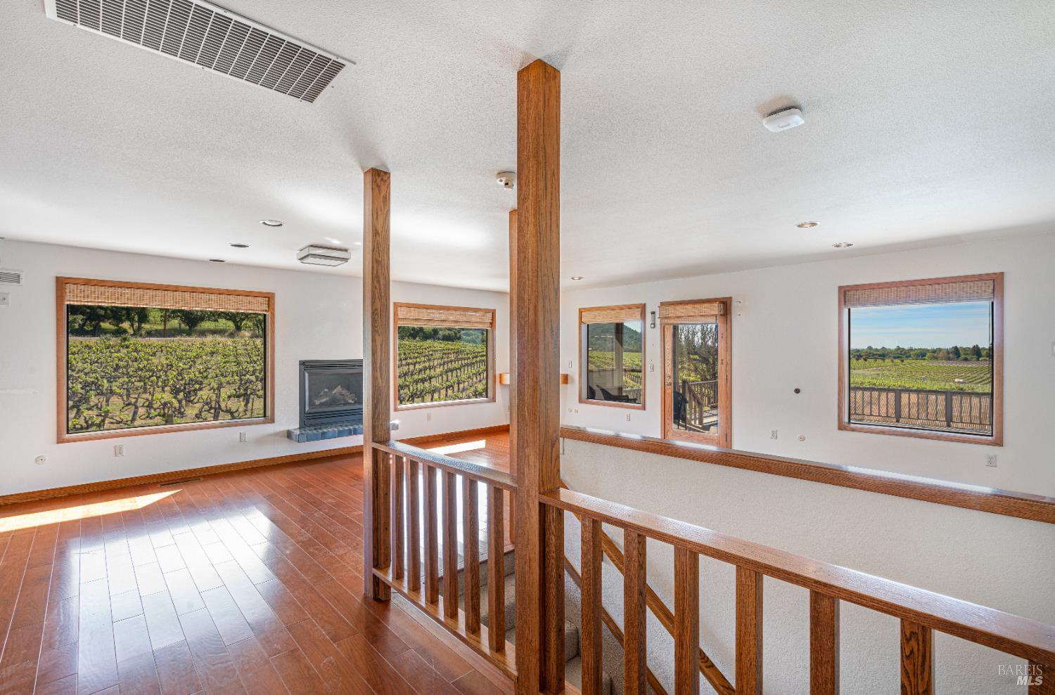 590 Pleasant Avenue Santa Rosa, CA 95403 - Photo 24 of 84 a view of an empty room with wooden floor and a window