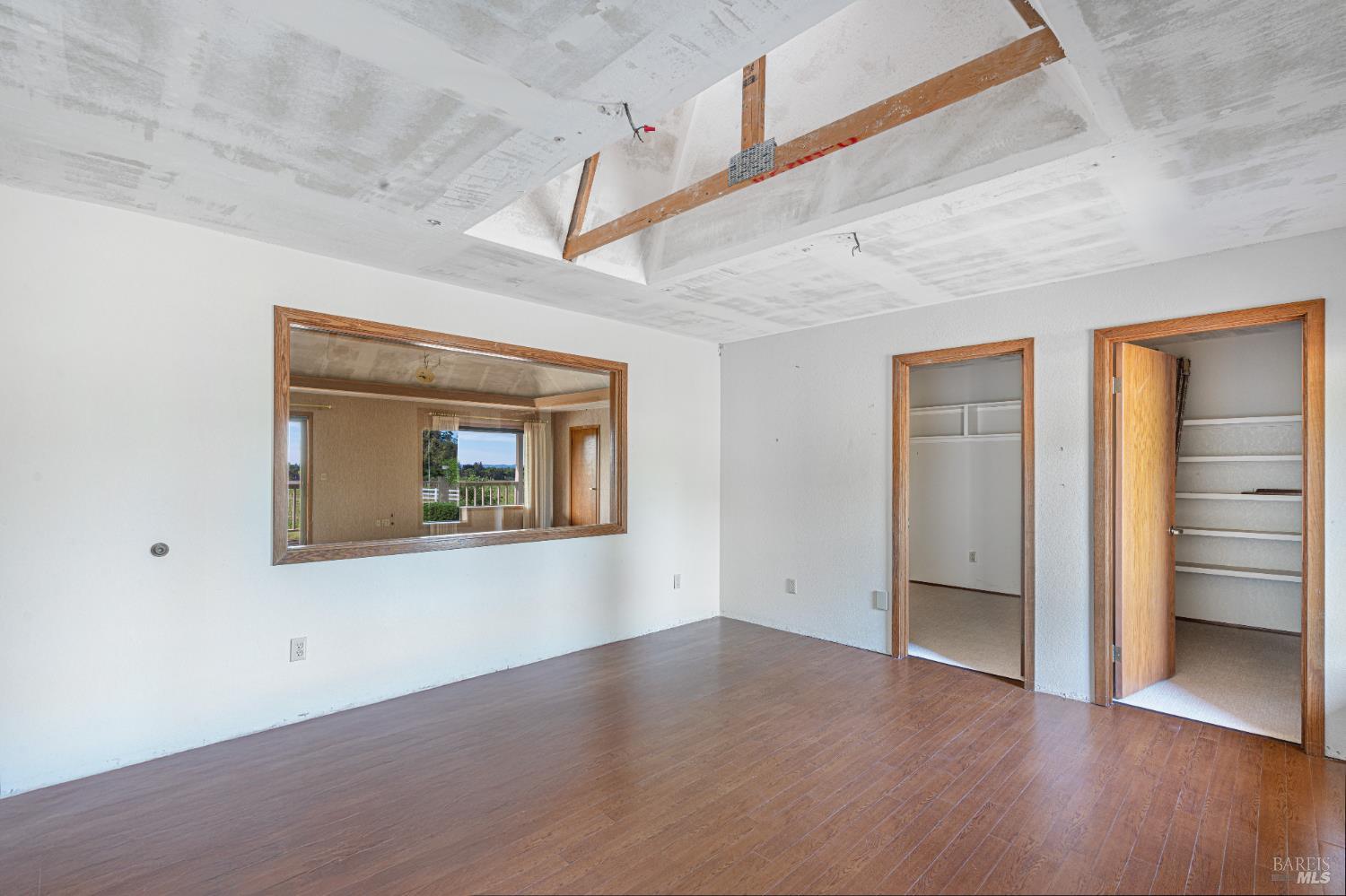 590 Pleasant Avenue Santa Rosa, CA 95403 - Photo 37 of 84 an empty room with wooden floor and windows