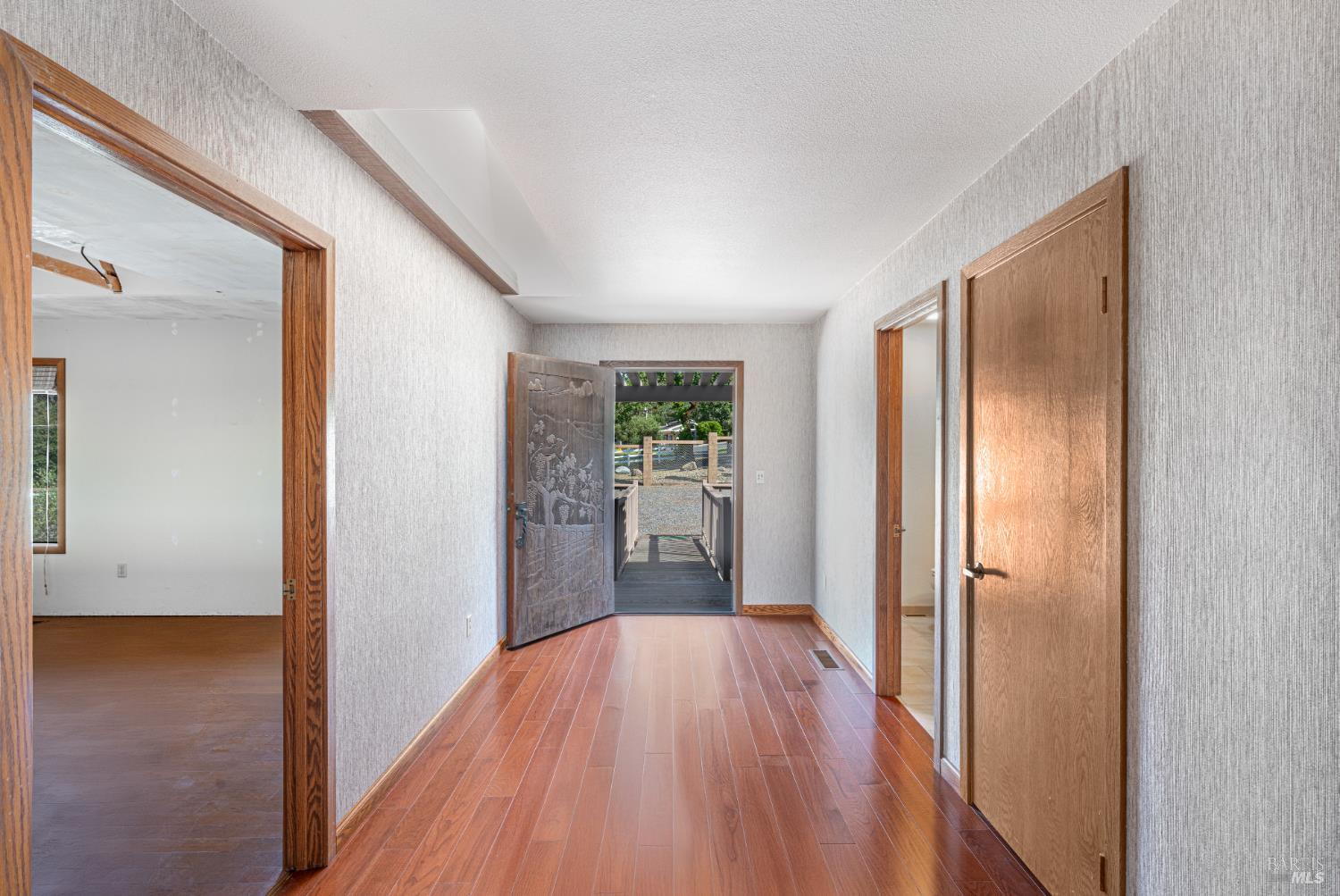 590 Pleasant Avenue Santa Rosa, CA 95403 - Photo 40 of 84 a view of a hallway with wooden floor and closet area