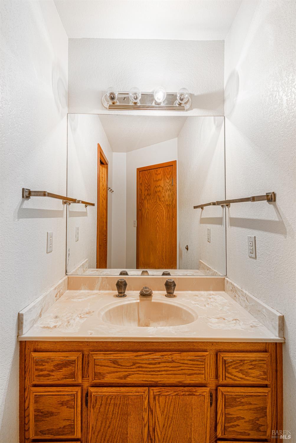 590 Pleasant Avenue Santa Rosa, CA 95403 - Photo 45 of 84 a bathroom with a sink and a mirror