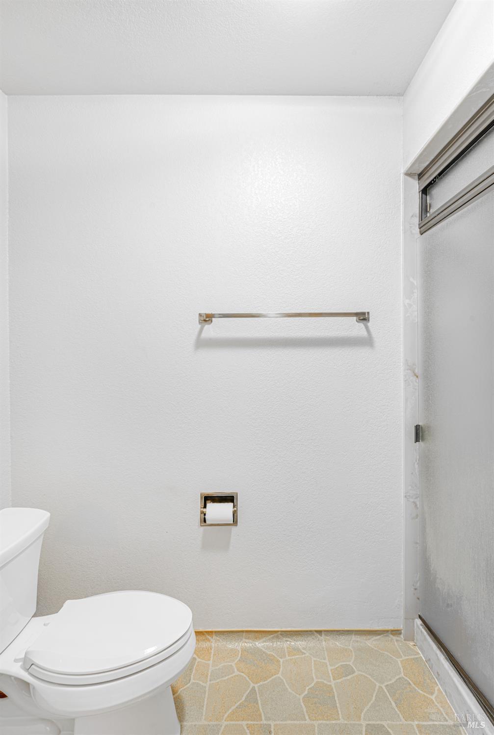 590 Pleasant Avenue Santa Rosa, CA 95403 - Photo 46 of 84 a bathroom with a toilet and a shower