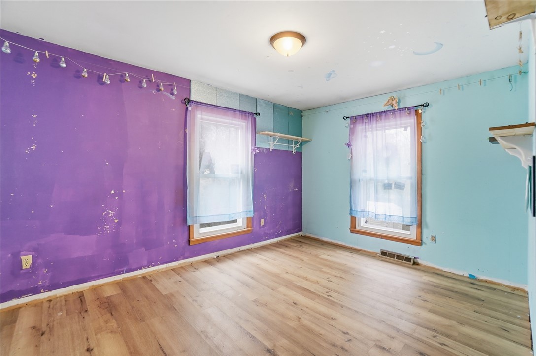 290 Ginghamsburg Road Tipp City, OH 45371 - Photo 23 of 49 This spacious bedroom offers abundant natural light, creating a bright and inviting atmosphere.