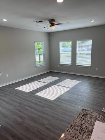 a kitchen with granite countertop a sink and a window