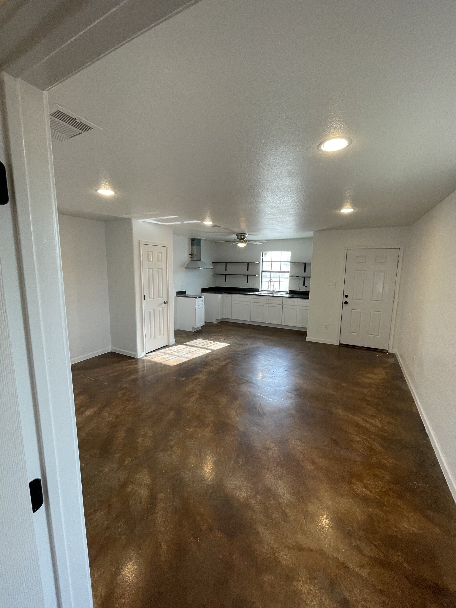 410 Sugar Haven, Unit A Kendleton, TX 77451 - Photo 4 of 13 a view of empty room with wooden floor