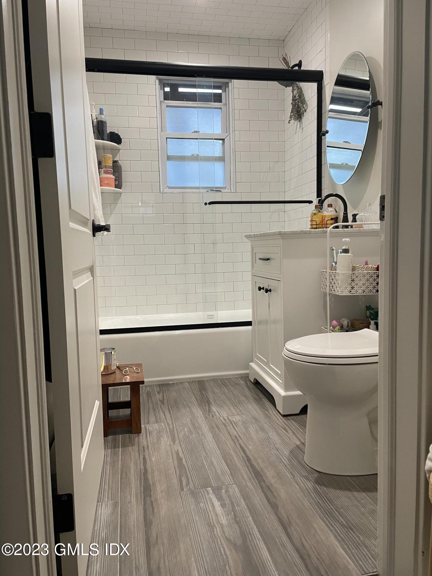60 Weaver Street, Unit 2 Greenwich, CT 06831 - Photo 12 of 20 a bathroom with a toilet and a shower