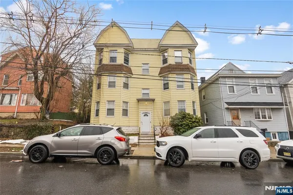 a car parked in front of a house