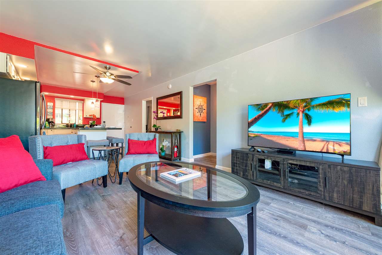 a room with furniture and a flat screen tv